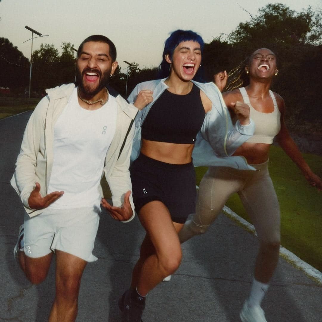 Runners laughing mid-stride, energy and ease under pressure